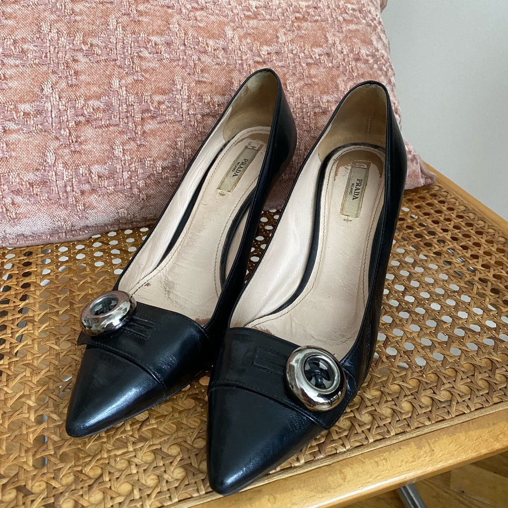 Prada Black Pointed-Toe Leather Pumps with Silver Circular Accent